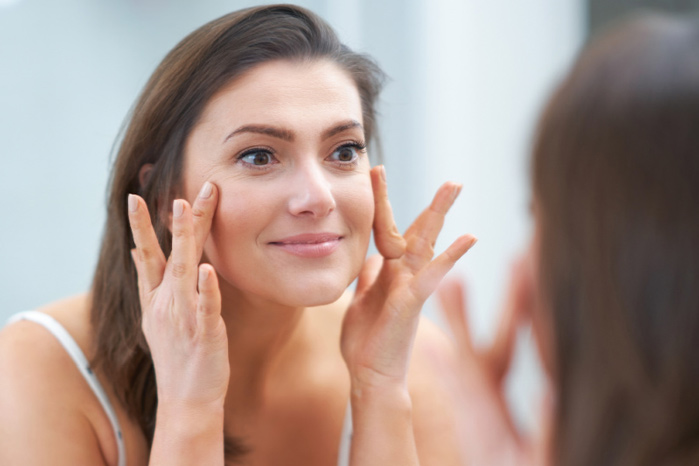 Brightening Defying Pads happy woman
