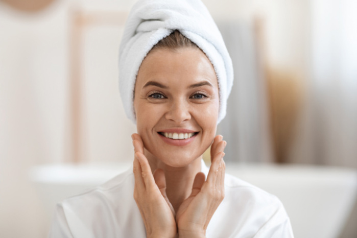 SHEER Brightening SPF 50 woman smiling